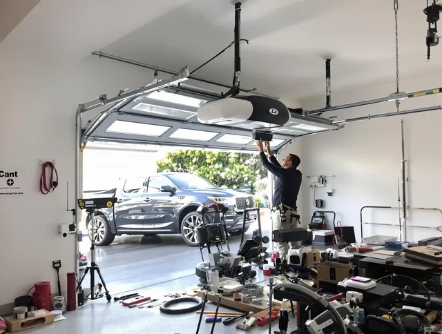 Heath Garage Door Repair specialist installing smart garage door opener system in Heath home