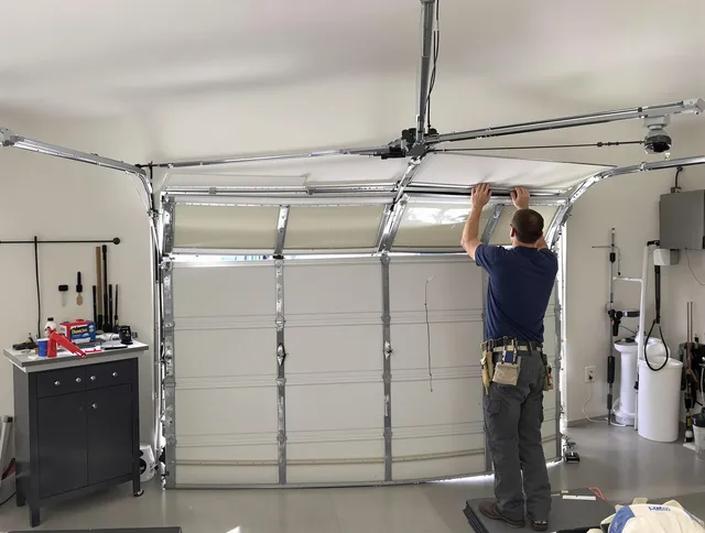 Heath Garage Door Repair specialist performing precise section replacement on Heath garage door